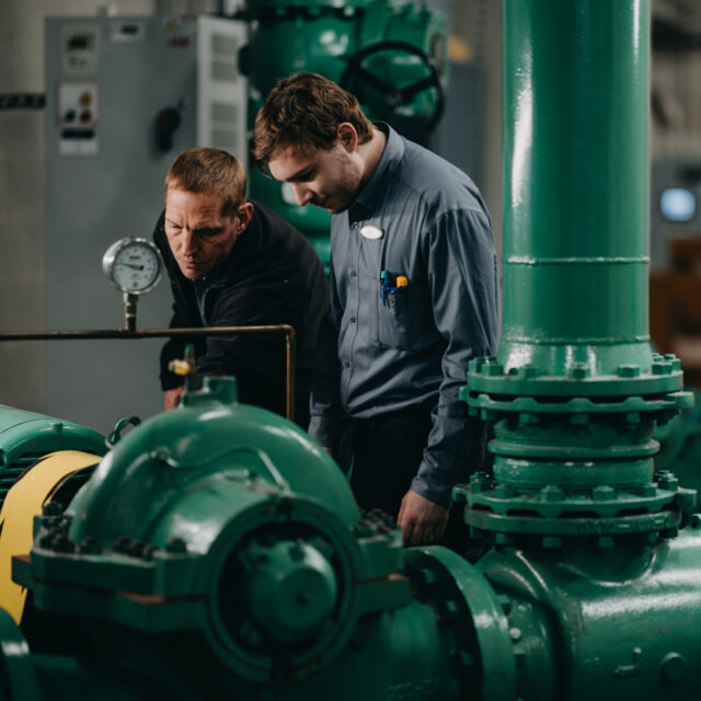 Two men inspecting equipment